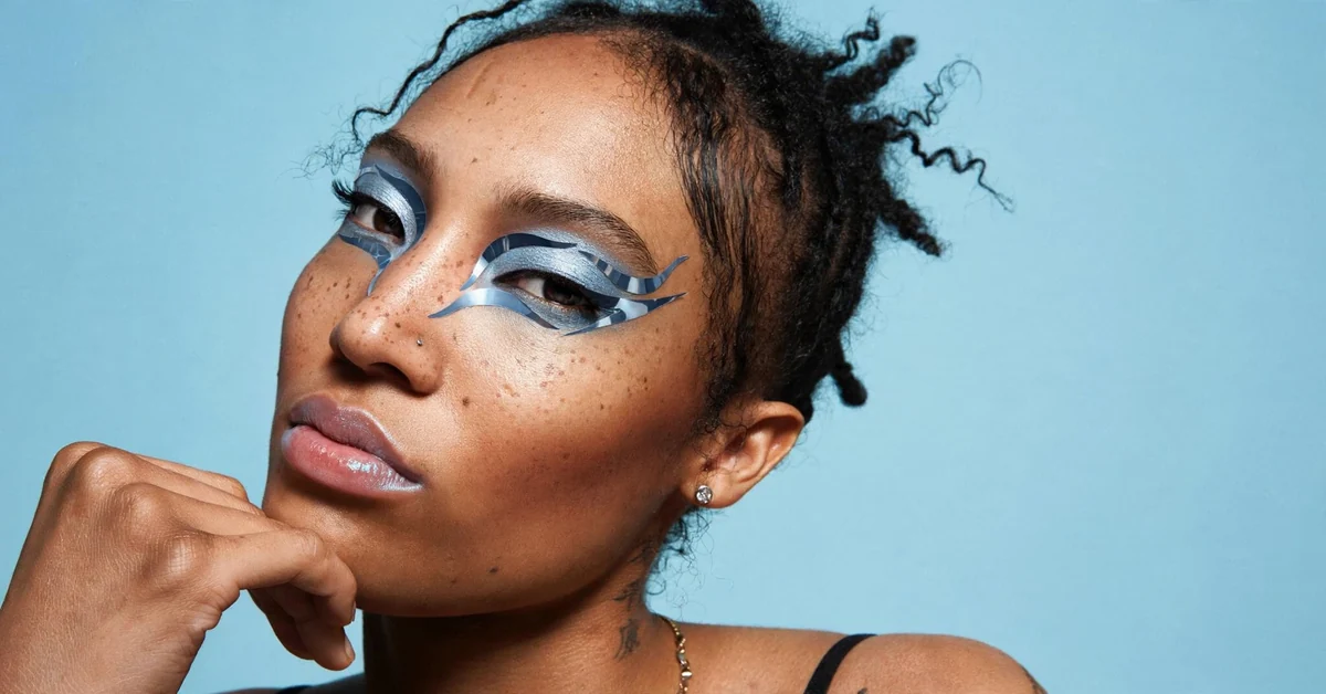 Chrome Goddess Makeup with futuristic silver metallic eyes